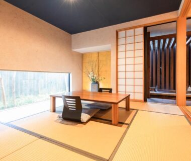 Traditional tatami room with low table, zaisu chair and shoji screens, bamboo view at Yushintei, Kanagawa