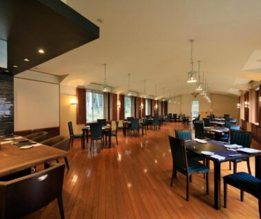 Spacious wood-floored dining with tables and pendant lights at Yutorelo Tateshina Hotel with DOGS, Nagano, Chūbu