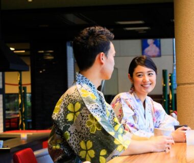 Two guests in yukata seated at a wooden counter, Yutorelo Yamaga, Kumamoto, Kyushu, Japan