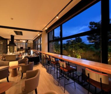 Spacious lounge with seating and bar counter at Yutorelo Yamaga in Kumamoto, Kyushu