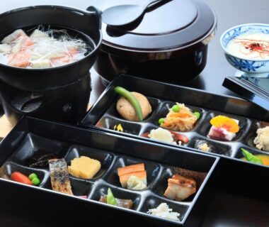 Assorted bento boxes and hot pot on lacquer tray at Yutorelo-an in Kanagawa Japan
