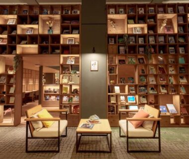 Cozy library lounge with floor-to-ceiling bookshelves at Yuuyu No Sato Yusa in Yamagata Tōhoku
