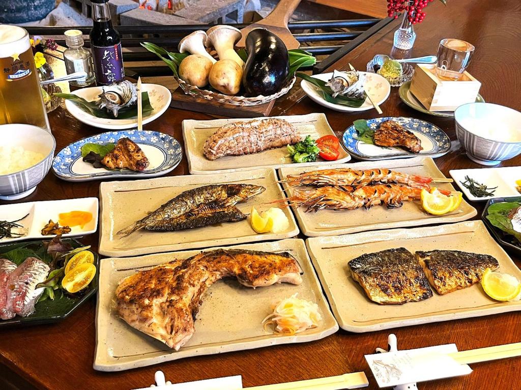 Grilled Fish Dinner Yuuzuru Shizuoka Assorted grilled fish and side dishes at Yuuzuru ryokan in Shizuoka