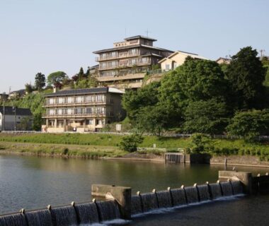 Riverbank view of Yuyaruru Saisai buildings along the water in Ishikawa, Chūbu region