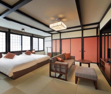 Spacious tatami room with twin beds at Zao Onsen Omiya Ryokan in Yamagata