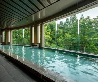 Long indoor onsen bath with forest view at Zao Shiki no Hotel, Yamagata