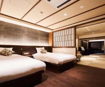 Western-style twin beds with tatami seating and shoji divider at Zao Shiki no Hotel in Yamagata, Tōhoku