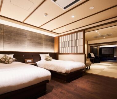 Western-style twin beds with tatami seating and shoji divider at Zao Shiki no Hotel in Yamagata, Tōhoku