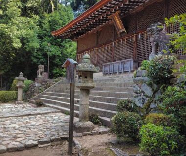 Stone lanterns, steps and wooden temple facade near add-Hostel Uji Cha-gan-ju-tei in Kyoto, Kansai