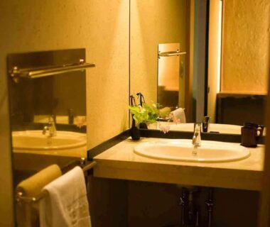 Bathroom sink and mirror in ryokan wash area at kanazawayuwakuonsen nihonryourisakaeya, Ishikawa Chūbu Japan