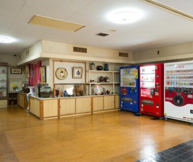 Lobby area with three vending machines and display shelves at kinugawaonsen Fukumatsu in Tochigi, Kantō, Japan