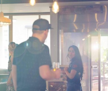 Guests chatting at ryokan lounge counter at mt inn in Fukushima Tohoku