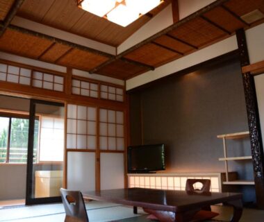 Tatami room with low table, shoji screens and balcony at nanaougi in Kanagawa, Kantō, Japan