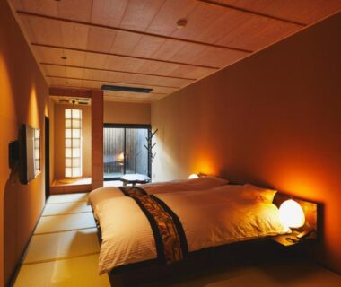 Low futon on tatami floor with shoji screen at nanaougi, Kanagawa, Kantō, Japan