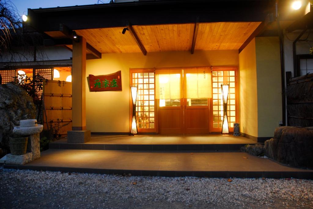 Illuminated entrance at nanaougi Ryokan Kanagawa Warm lit entrance with shoji screens at nanaougi in Kanagawa, Kantō Japan