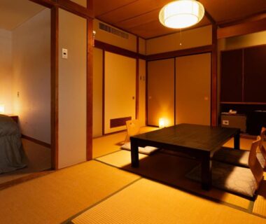 Warm tatami room with low table, shoji screens and bed at soraichi, Miyagi, Tōhoku, Japan