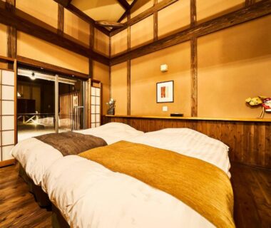 Wooden interior with shoji screens and twin beds at Chalet de montagne Hibari d'Asagiri in Kumamoto Kyushu