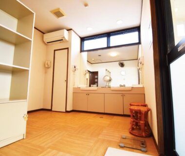 Double sink vanity with mirrors, wooden floor and shelving at Oyado Kokoro, Gifu Chubu, Japan