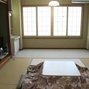 Tatami room with kotatsu and shoji screens at Oyado Marutoya in Nagano, Chūbu, Japan
