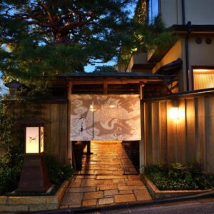 Stone pathway, noren curtain and lanterns at Tsurukō in Ishikawa, Chūbu