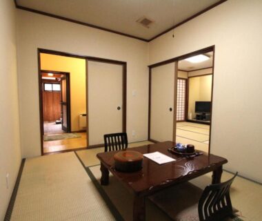 Traditional tatami room with low table and zaisu chairs at Hirayunomori Bettei Yuuka Sanzōan in Gifu