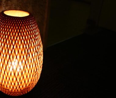 Warm woven lantern illuminating tatami floor at Fukabe Ryokan, Chūbu Shizuoka