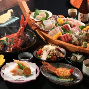 Assorted sashimi boat with grilled seafood, side dishes and sake at Fukabe in Shizuoka