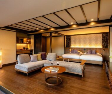 Western-style beds with low lounge seating, shoji screens and wooden flooring at MACHIYADO ICHIRYU in Gifu, Chūbu