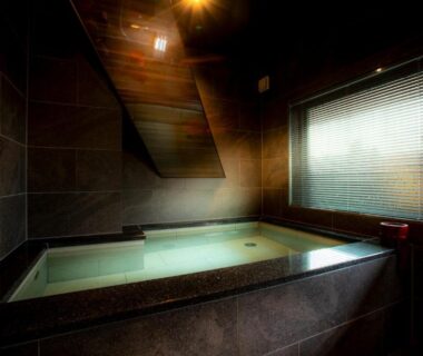 Indoor stone onsen tub with wooden blinds at MACHIYADO ICHIRYU, Gifu, Chūbu