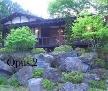 Wooden ryokan facade above rock garden at Yasuragi no Bettei Shikitei, Yamanashi Chūbu