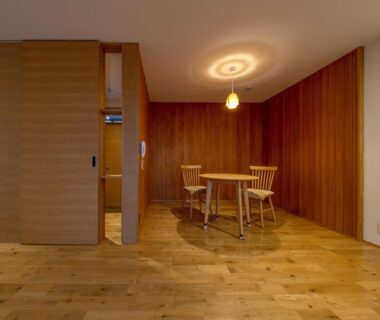 Minimal wooden interior with round table, two chairs and pendant light at Magohachi, Gifu, Chūbu