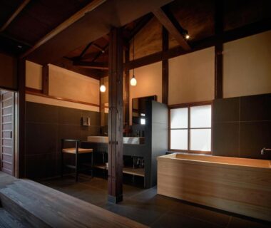 Interior wooden soaking tub with exposed beams at Kyo no Yado Ishihara Kyoto