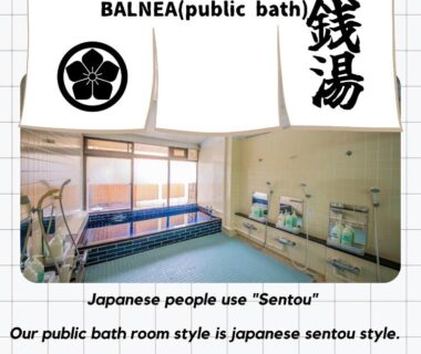 Tiled sento style public bath with shower stations and large windows at HifumiRyokan Kyoto Station Japan