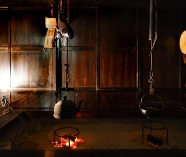Traditional wooden interior with irori hearth and hanging kettles at 信州の古民家宿 真秀ろばmahoroba, Nagano