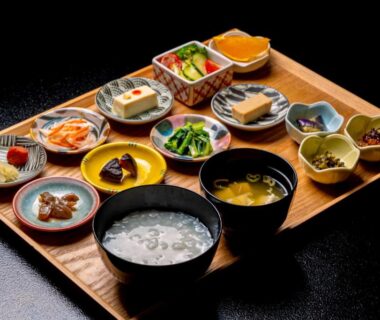 Wooden tray of assorted small Japanese dishes and soup served at Yakuōin near Zenkoji, Nagano