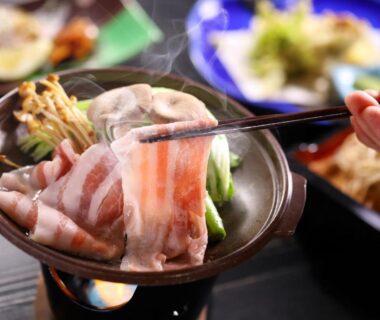 Thin sliced meat simmering in tabletop hot pot at Ryokan Yama no Takohei Hotaka Onsen Azumino Nagano