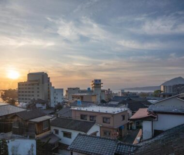 Rooftops with rising steam at sunset near ManrikiyaBekkan Beppu Ōita