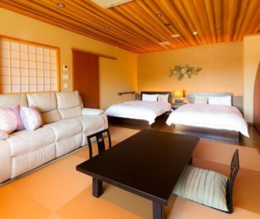 Tatami room with twin beds, low table and sofa at Nanakusa no Yu, Bessho Onsen, Nagano