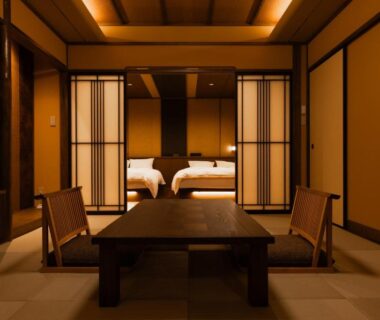 Low table and tatami seating with twin beds at Bettei Tateshina Kunpū in Nagano Chūbu
