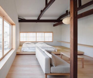 Tatami-style room with futon bedding, sofa and shoji window at Bettei Nakanoya, Tochigi