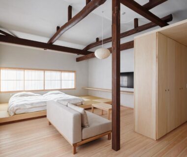 Bright tatami room with futon, shoji screens, exposed wooden beams at Bettei Nakanoya in Tochigi