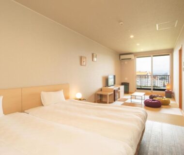 Twin beds with tatami seating at Kachōfūgetsu Nagomi no Yu, Nanki Shirahama, Wakayama