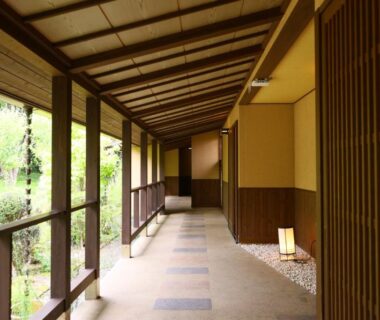 Covered wooden corridor with garden view at Nagomi no Yuyado Nakayama in Nagano