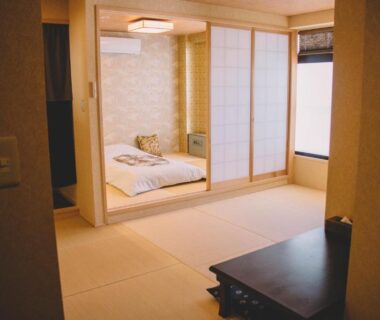 Traditional tatami room with futon, shoji screens and low table at Waseidō Zen in Hyōgo, Kansai