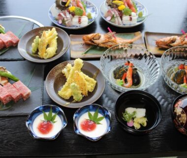Assorted traditional Japanese dishes including tempura and grilled fish at Ryokan Sakamotoya in Kyoto