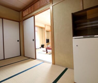 Tatami room with fusuma and low table at Ryokan Ōmasa in Saga, Kyushu, Japan
