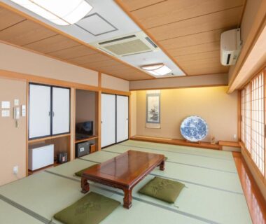 Traditional tatami room with low table and shoji screens at Shirakawagō no Yu in Chūbu, Gifu, Japan