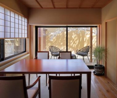 Shoji screens, wooden table and chairs with mountain view at TENDOSO Yamagata