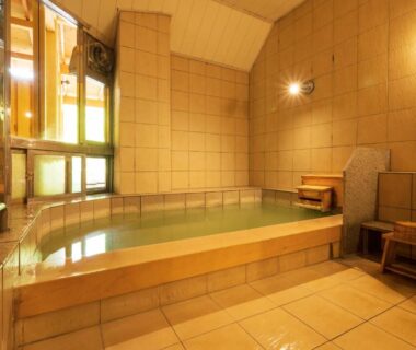Tiled indoor onsen bath with stool and wash area at Yunomori Okunikko, Tochigi, Kantō, Japan