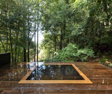 Square outdoor onsen bath on wooden deck at Kaze no Mori in Oku-Takeo Onsen, Saga